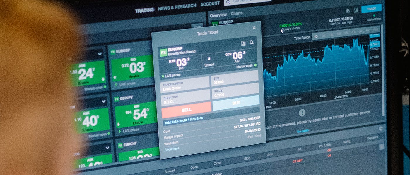 Person looking at trading data on a monitor