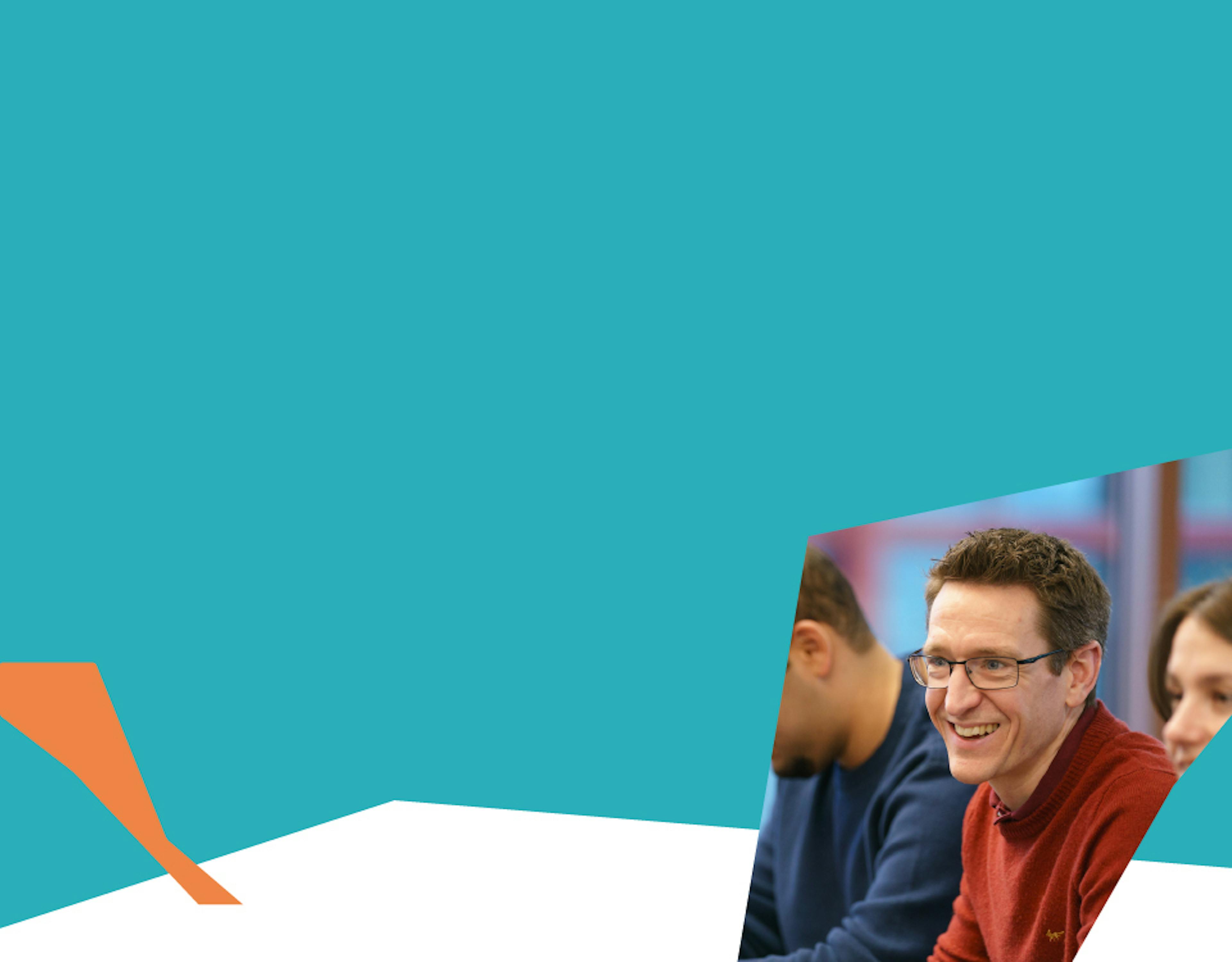 Backup like a startup – Smiling man in a meeting