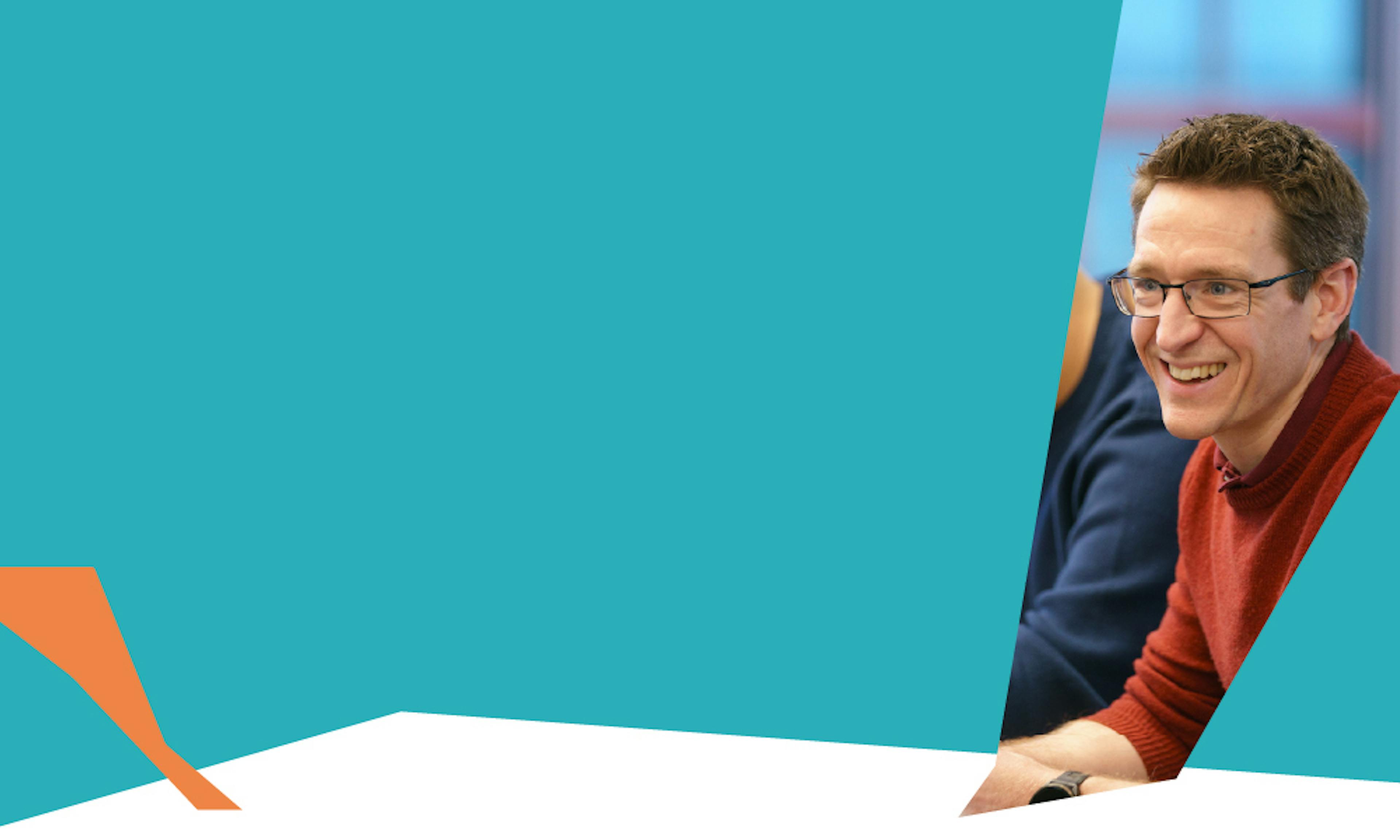 Backup like a startup – Smiling man in a meeting
