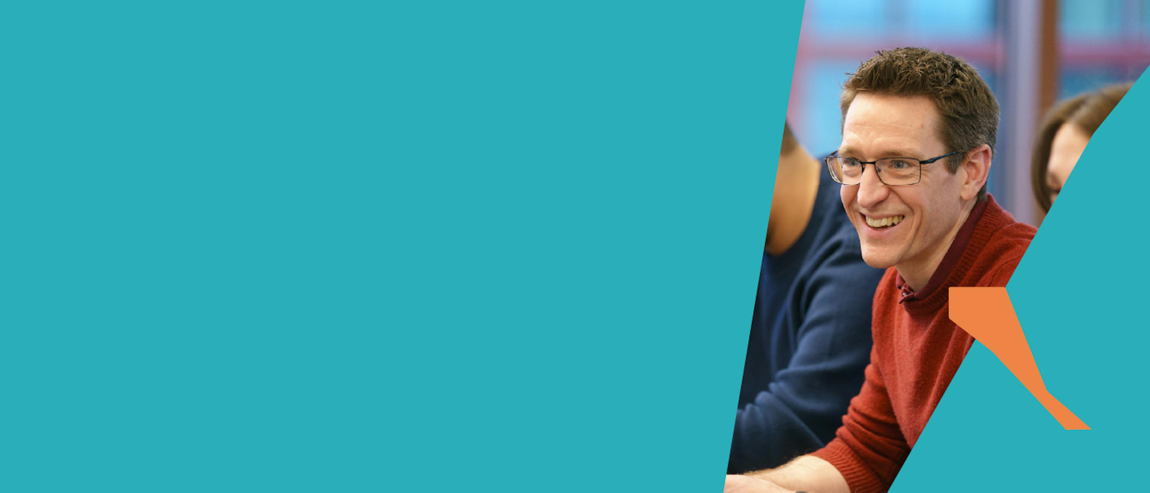 Backup like a startup – Smiling man in a meeting
