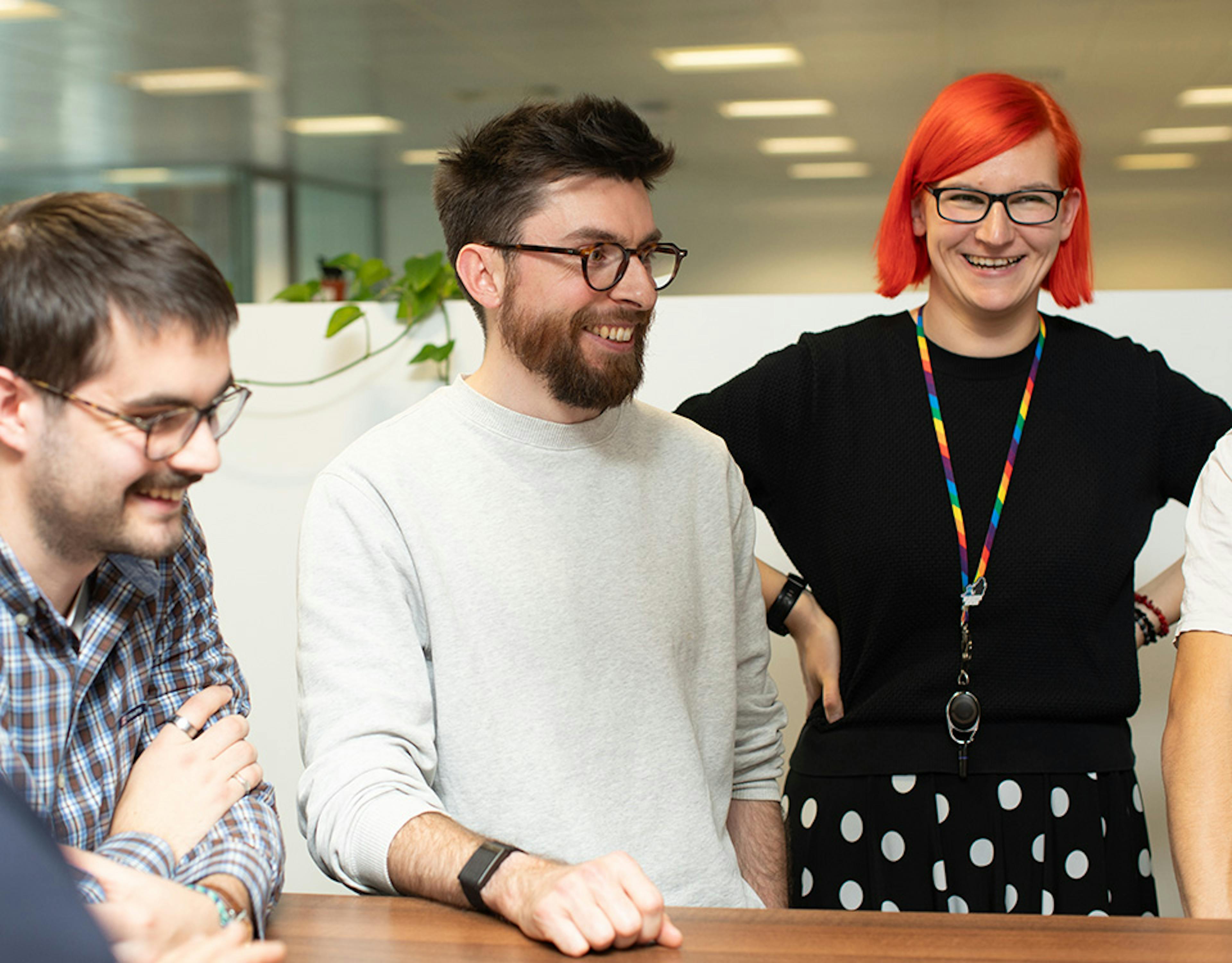 People in an office in a stand-up meeting