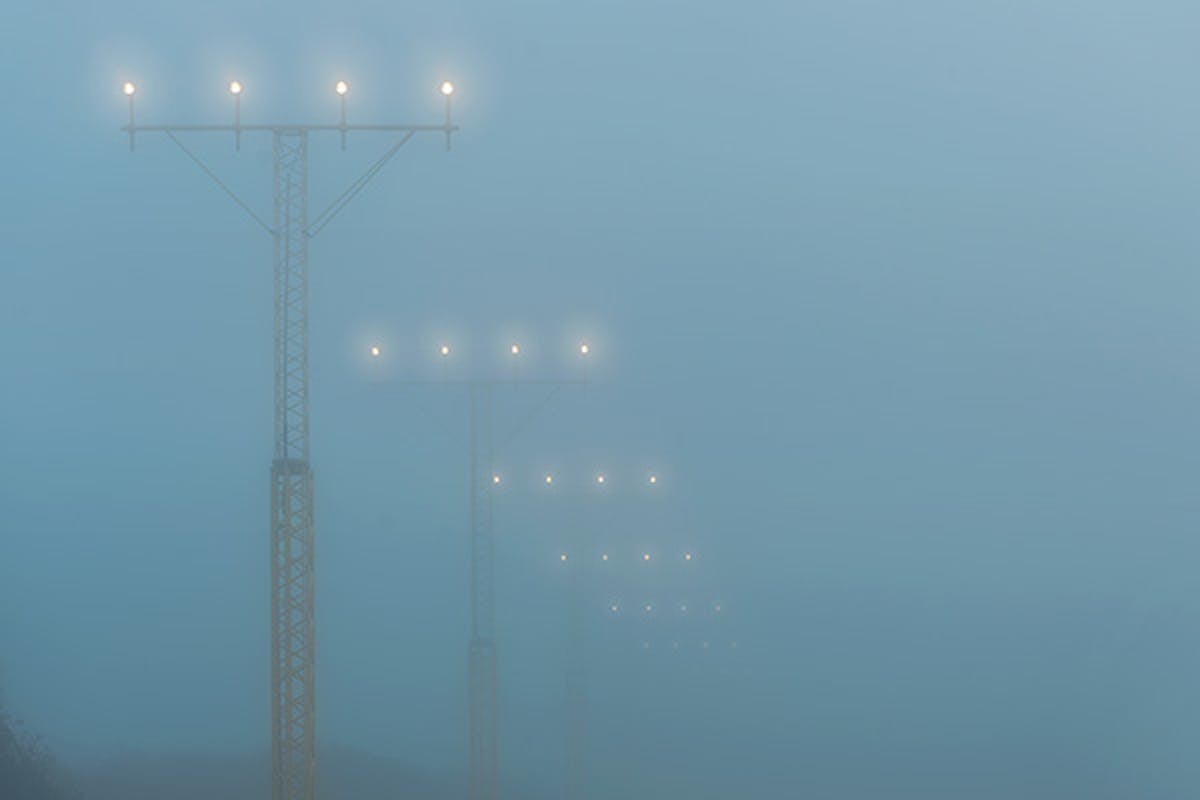 Airport landing lights in heavy fog