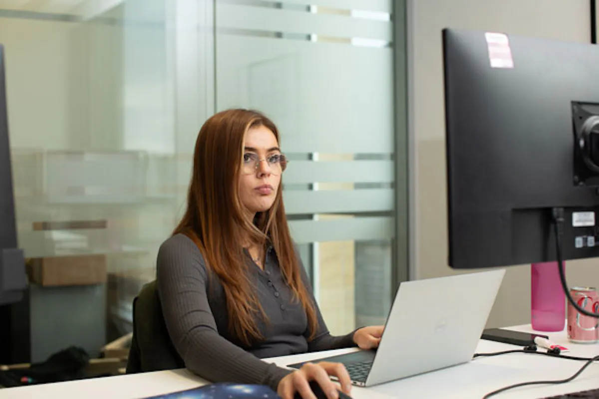 Person working on their laptop in an office