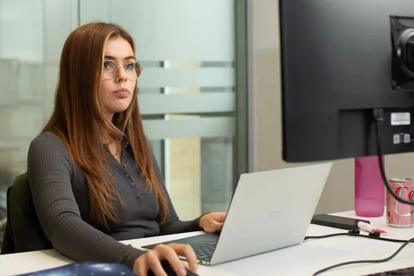 Person working on their laptop in an office