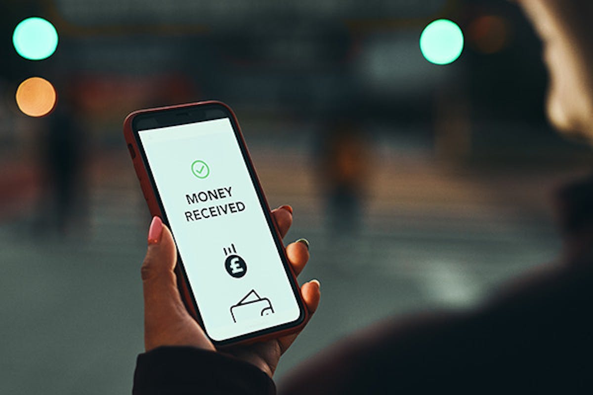 Mobile phone displaying the message, 'Money received'