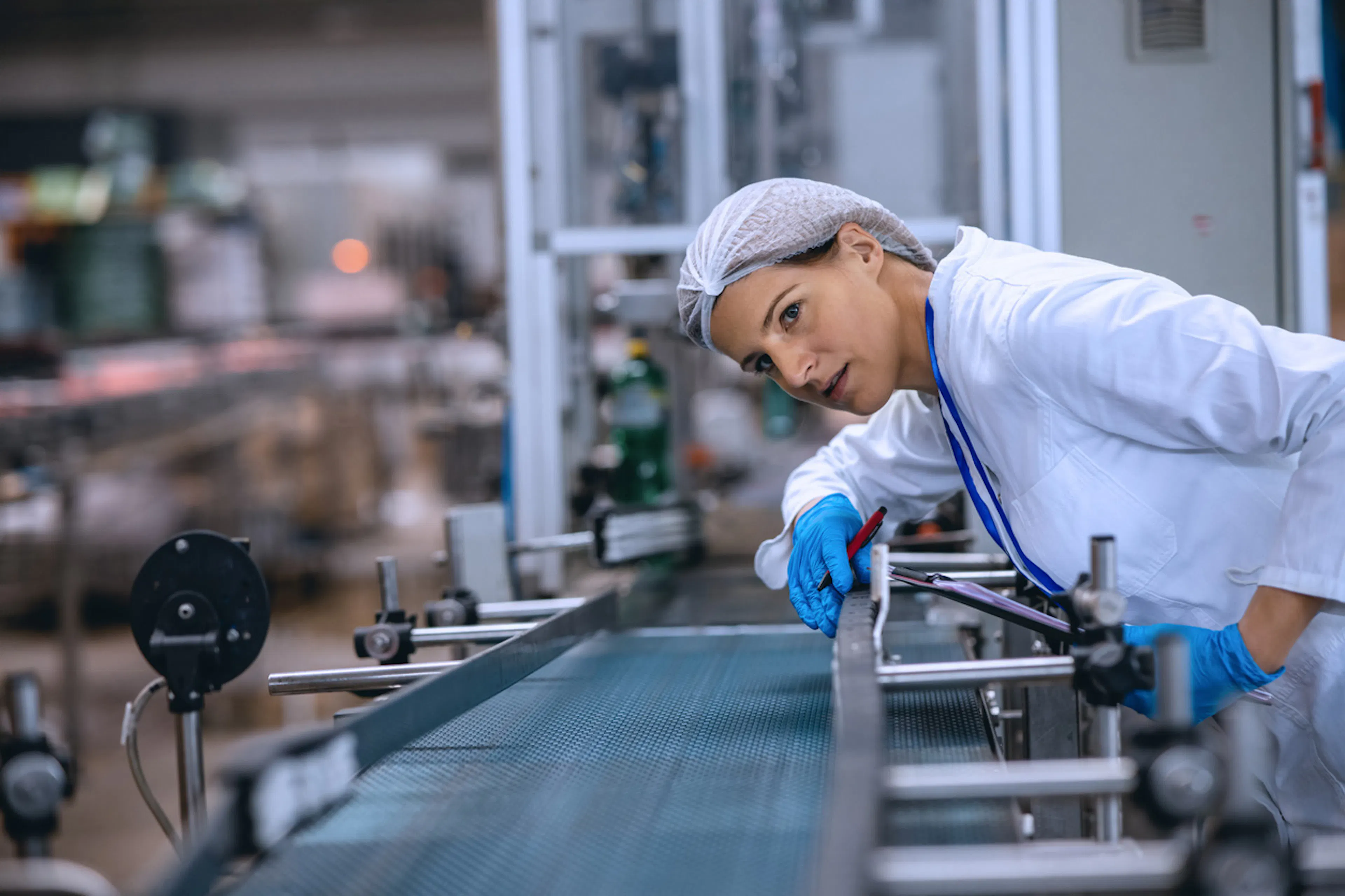 factory line inspector investigating technology component