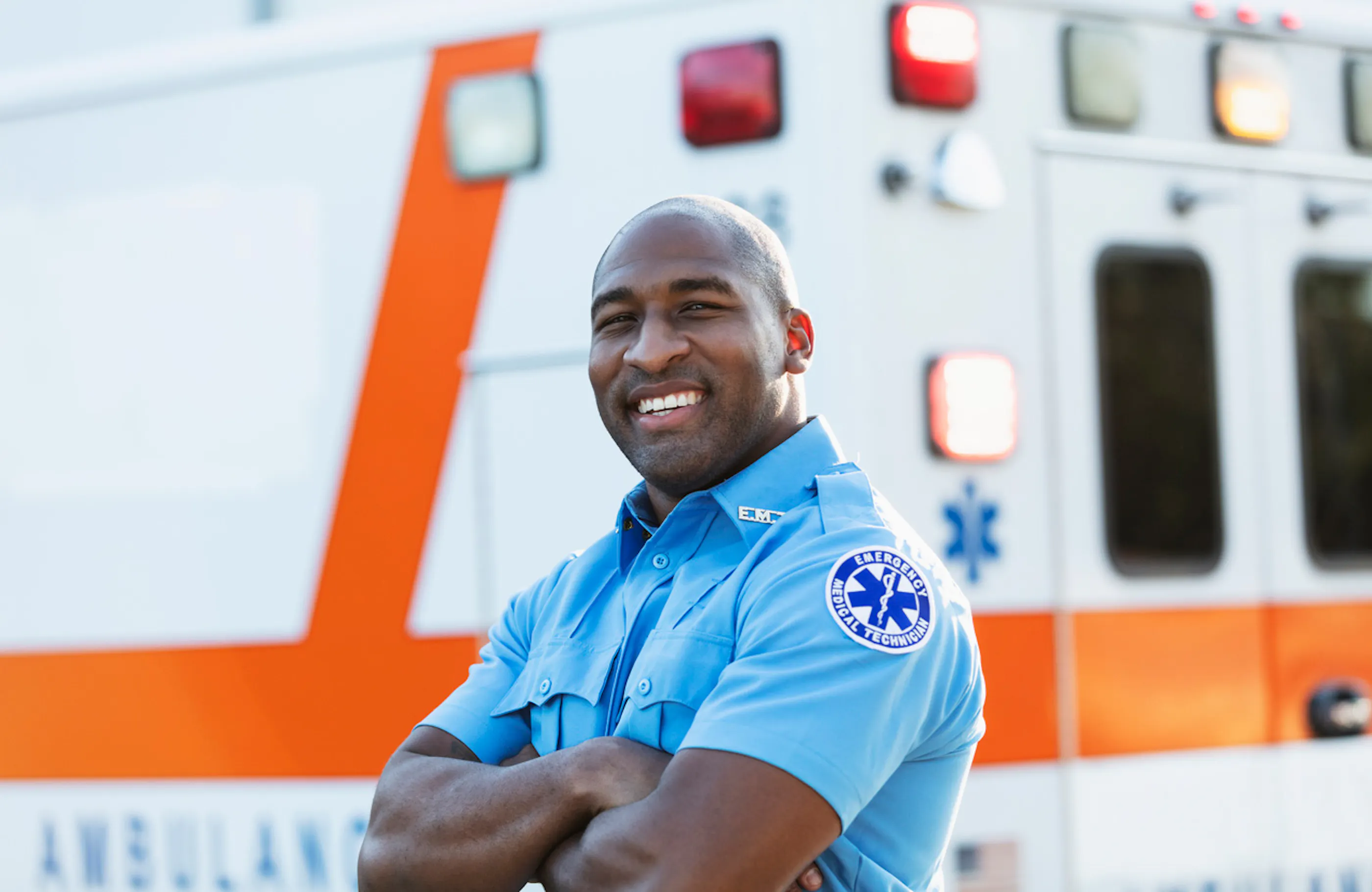 EMT standing in front of an ambulance