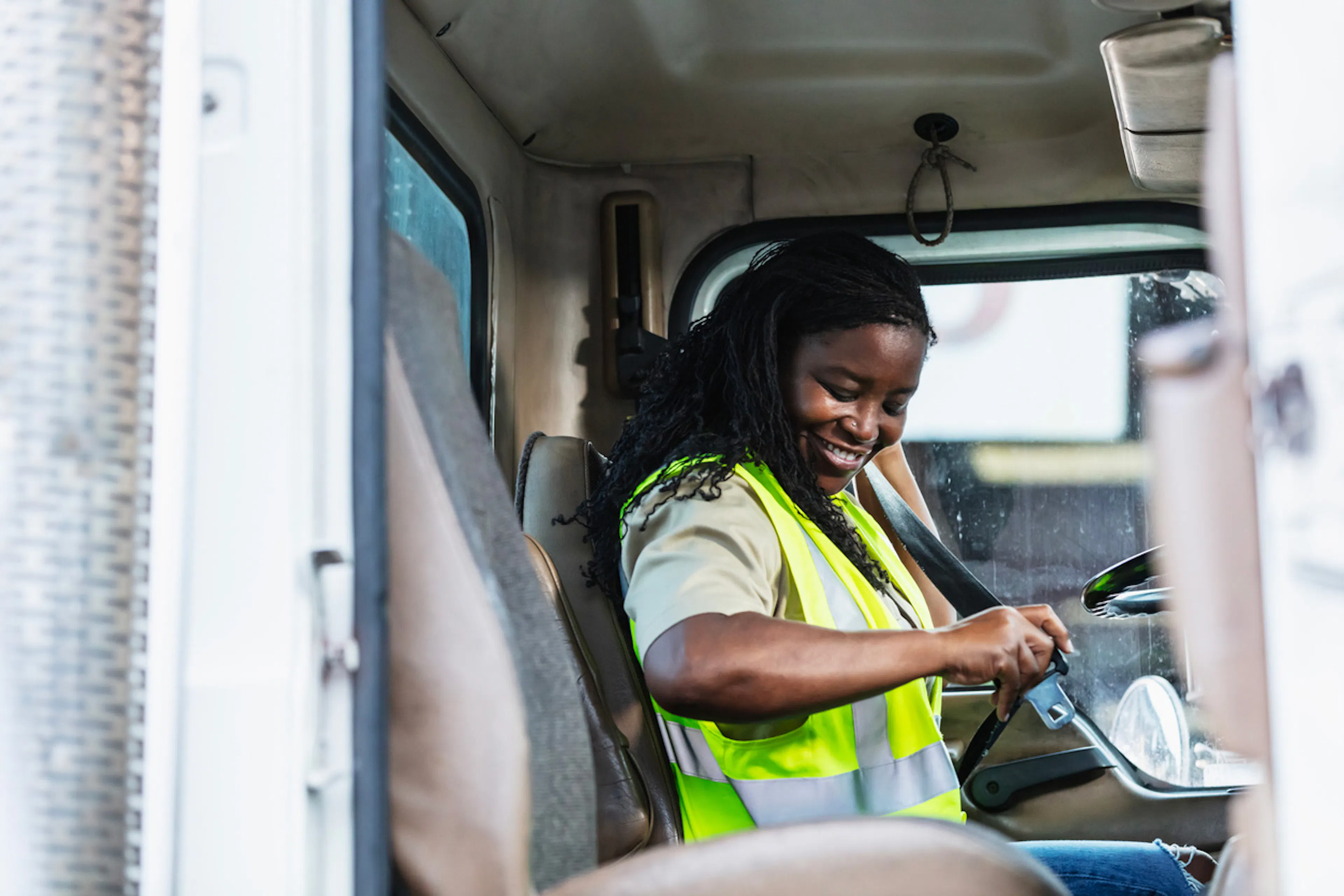 delivery driver putting on a seatbelt