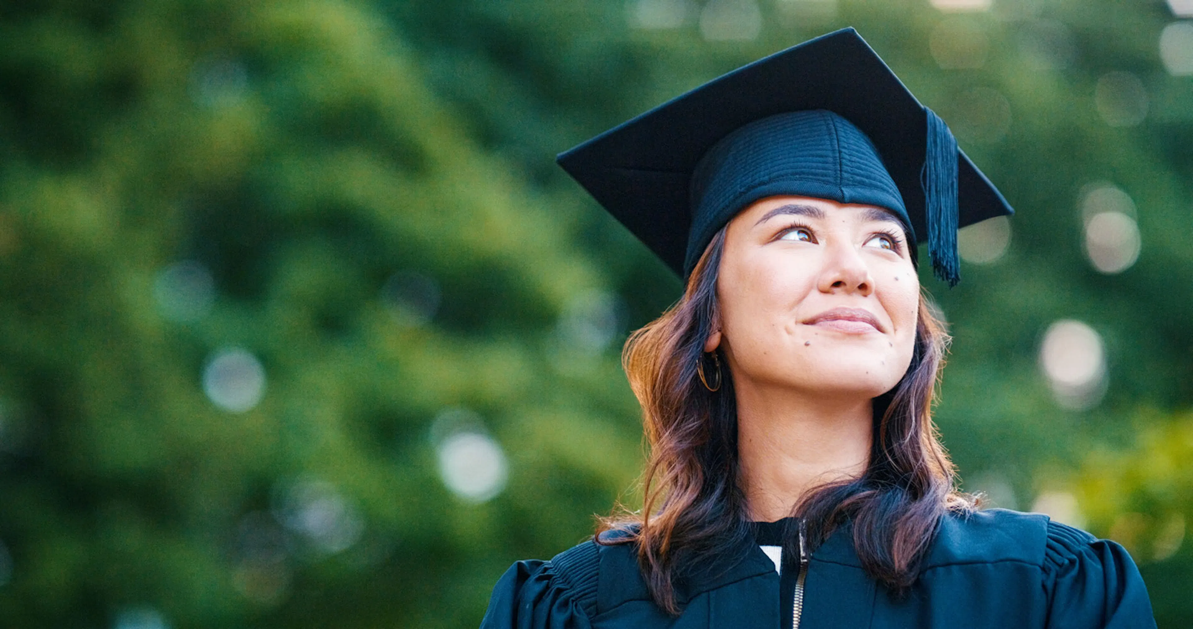 woman in cap and gown looking to the side