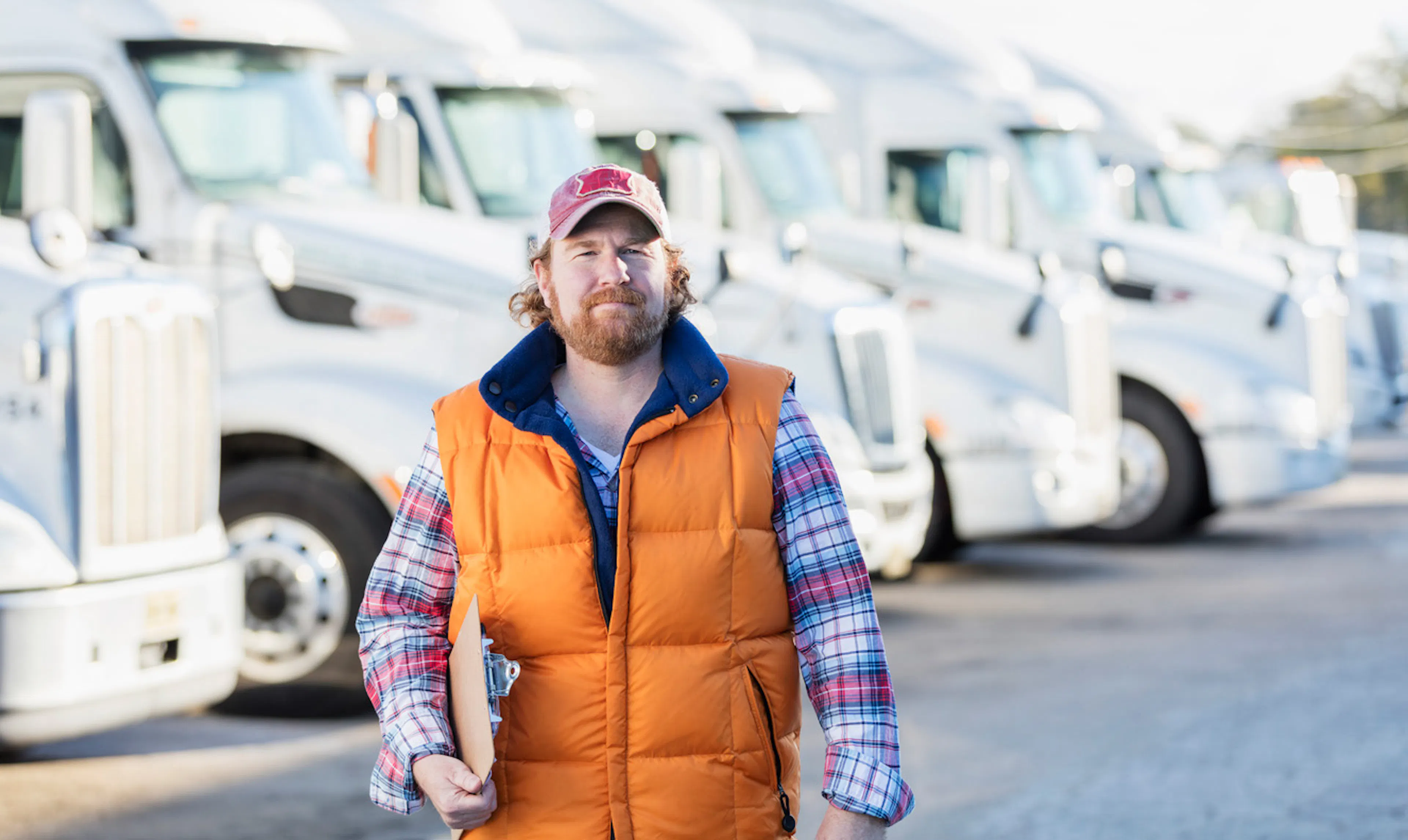 commercial truck driver holding clipboard