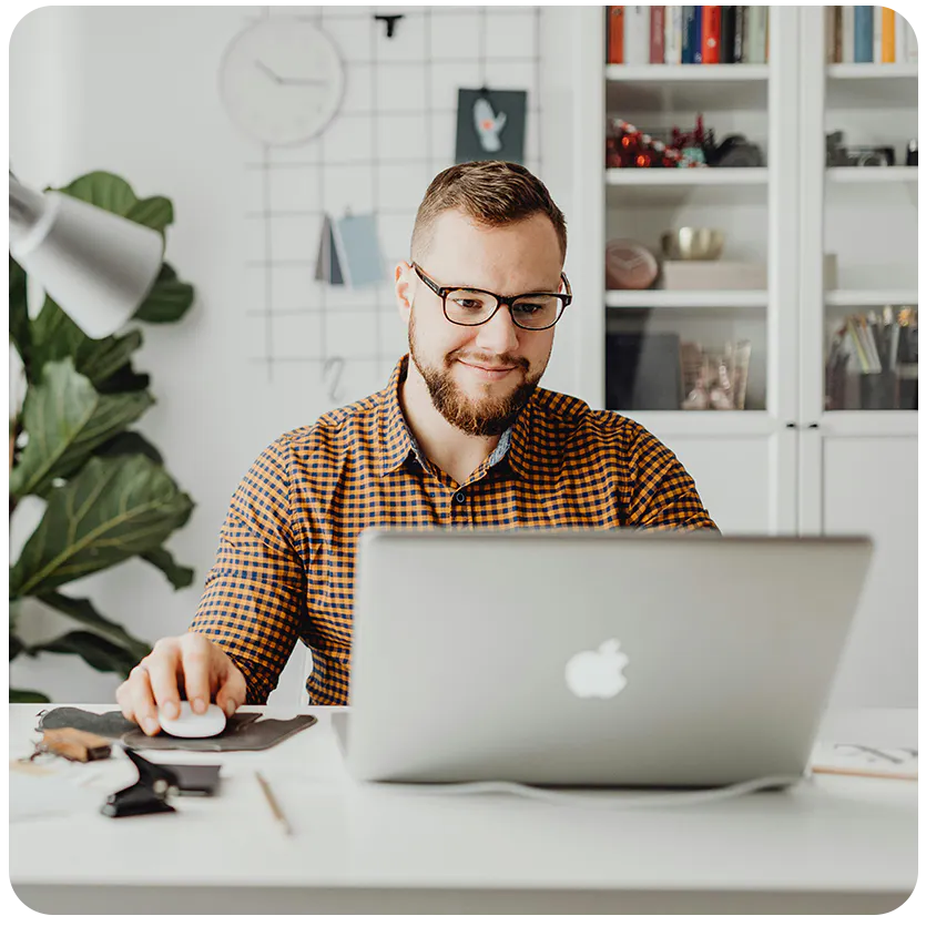 man working on an apple laptop