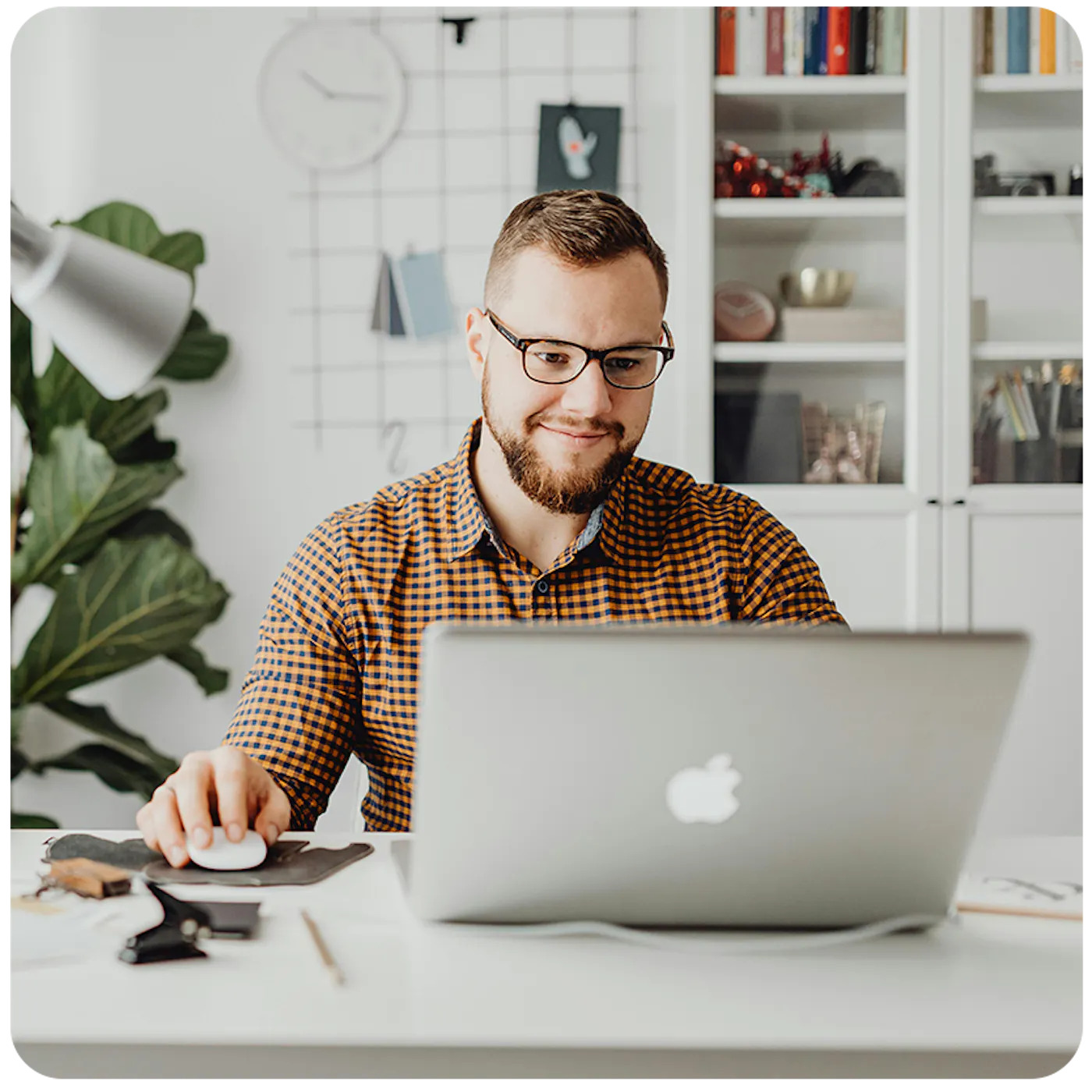 man working on an apple laptop