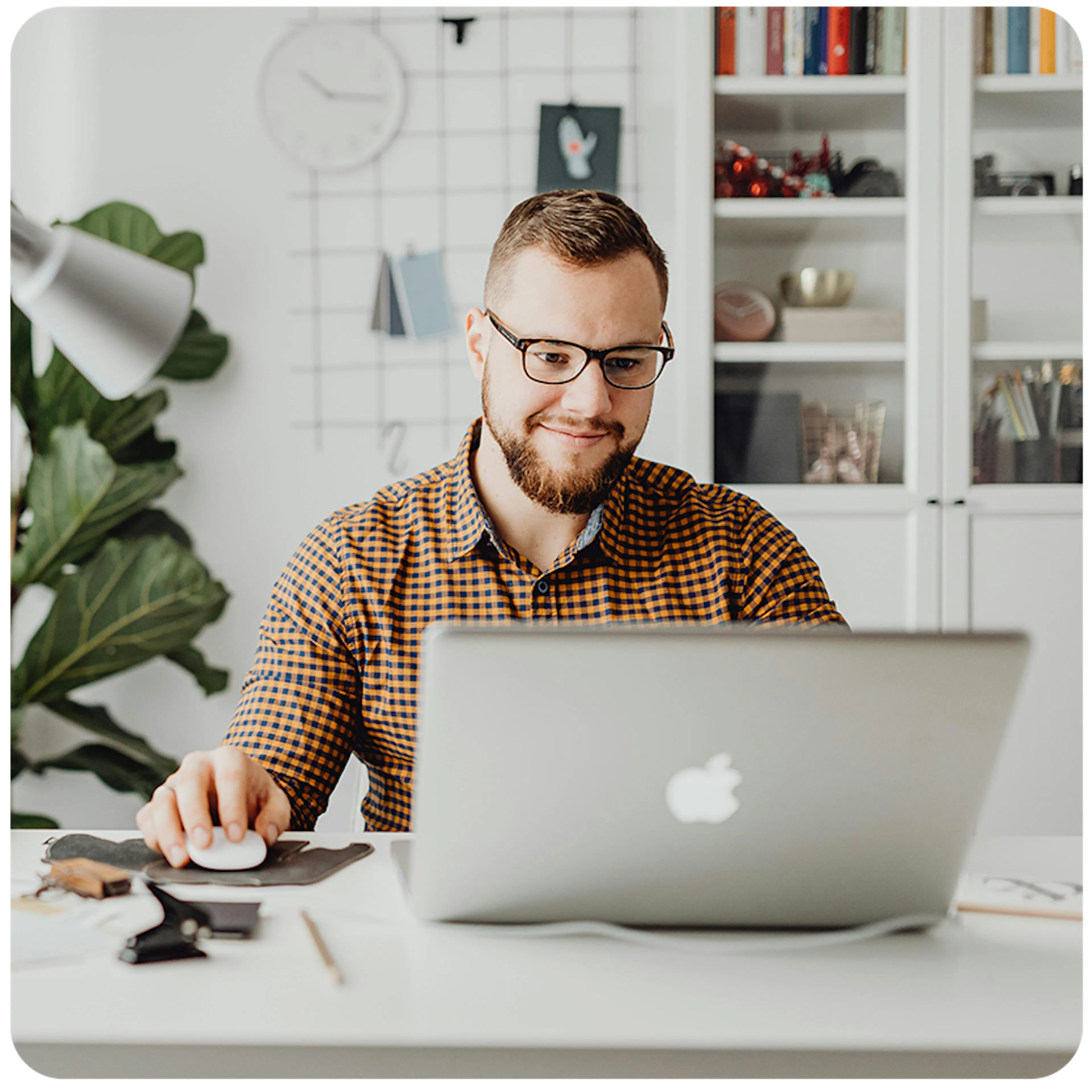 man working on an apple laptop
