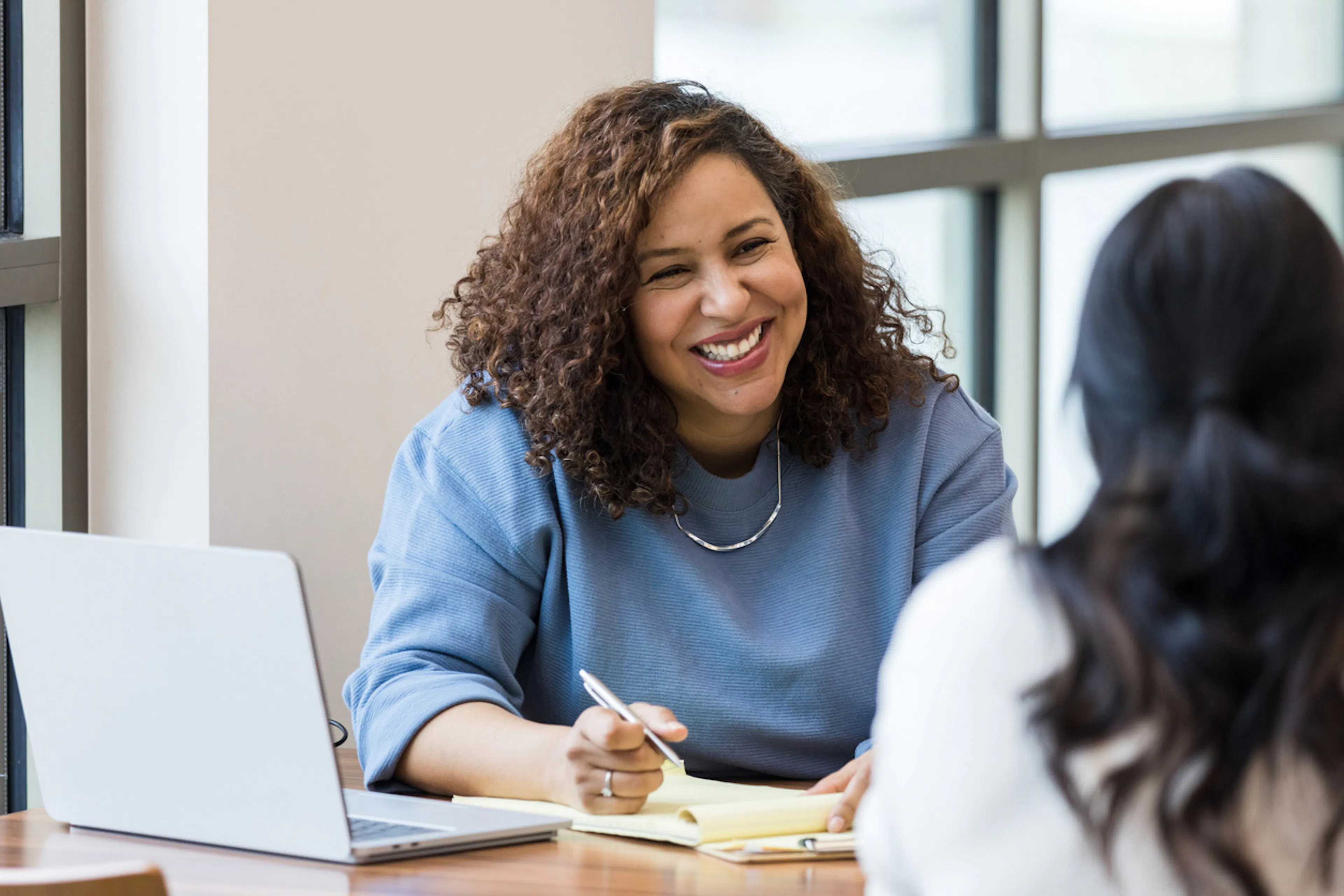 woman conducting an interview with a job seeker