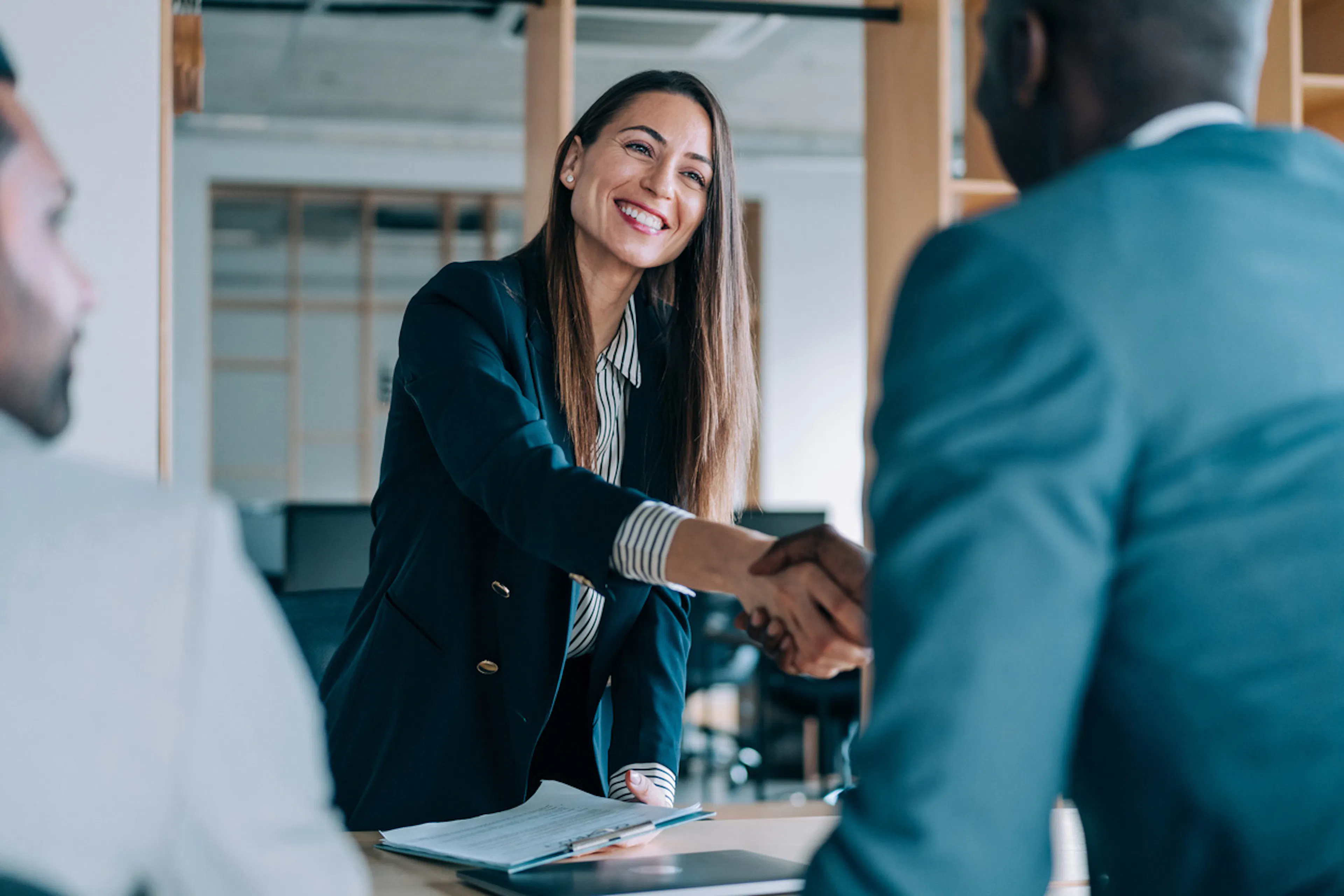 woman shaking hands after an interview
