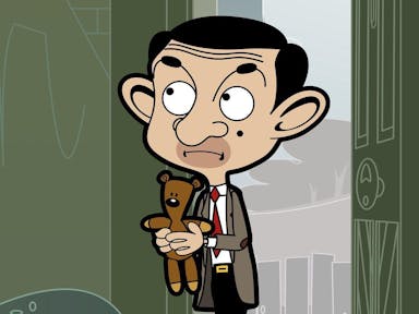 Animation of a middle aged white man in a grey suit, with big ears and a mole on his face, holding a small brown teddy bear