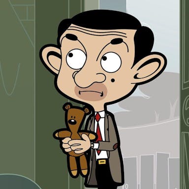 Animation of a middle aged white man in a grey suit, with big ears and a mole on his face, holding a small brown teddy bear