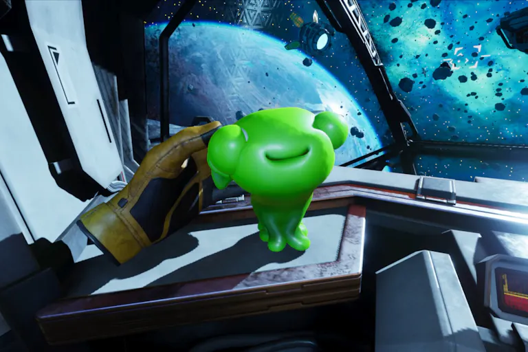 Gameplay of a floating armless yellow glove stroking a cute gelatinous green alien creature on board a spaceship