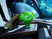 Gameplay of a floating armless yellow glove stroking a cute gelatinous green alien creature on board a spaceship