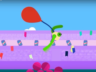 A green cartoon game figure with long arms is moving along a purple track of confetti and 'gulp' drink cans, with a red balloon in tow