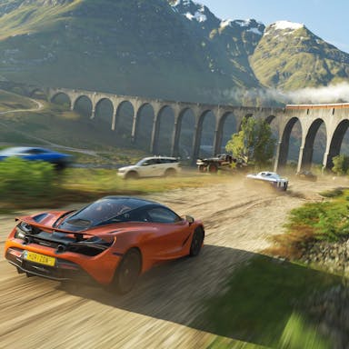 Gameplay of a car speeding towards a viaduct in a scenic, mountain landscape