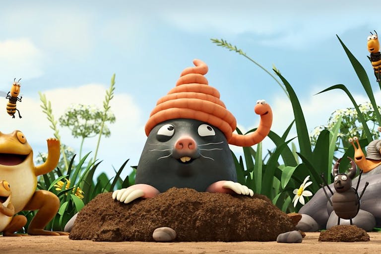 Animated image of a worm wrapped around the head of a mole, and various other creatures surrounding them and smiling including snails and frogs.