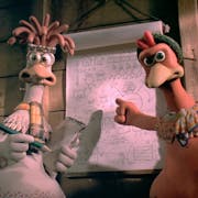 Stop motion animation of two chickens in a hen coop pointing at flip paper with diagrams on plotting their escape