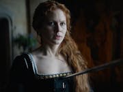 Red-headed woman in Elizabethan dress