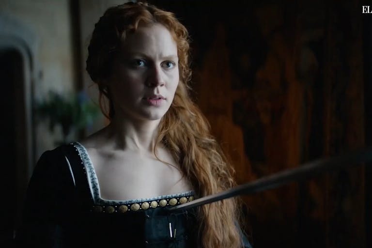 Red-headed woman in Elizabethan dress