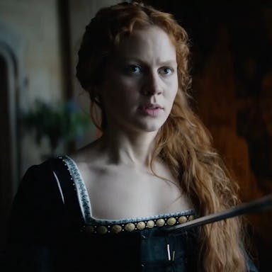 Red-headed woman in Elizabethan dress