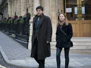 Man and woman walking on the street in London