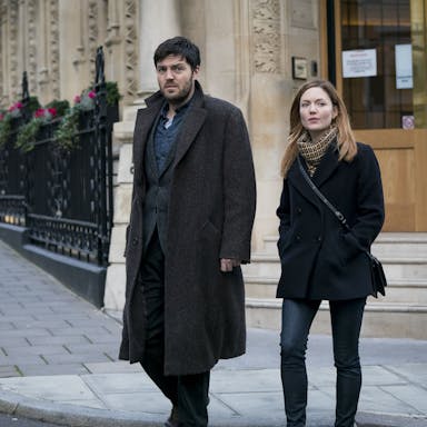 Man and woman walking on the street in London