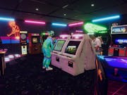 Gameplay of a retro arcade light neon, characters playing arcades
