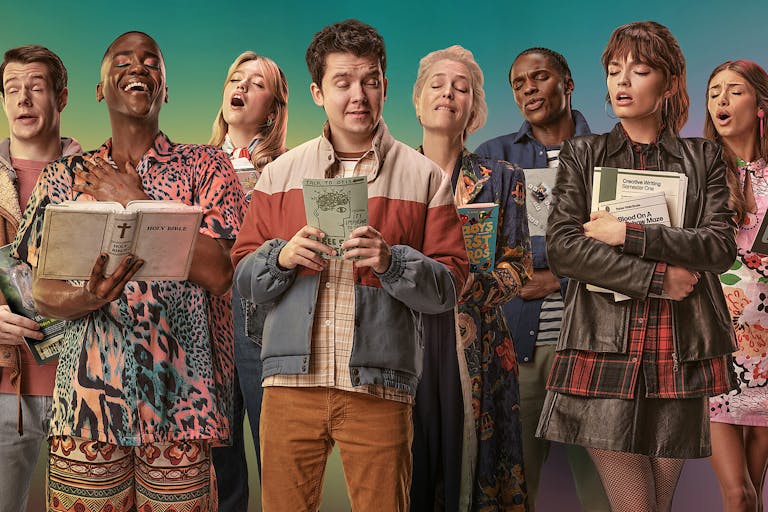 A line of people in a choir-like formation, with expressive faces mid-singing