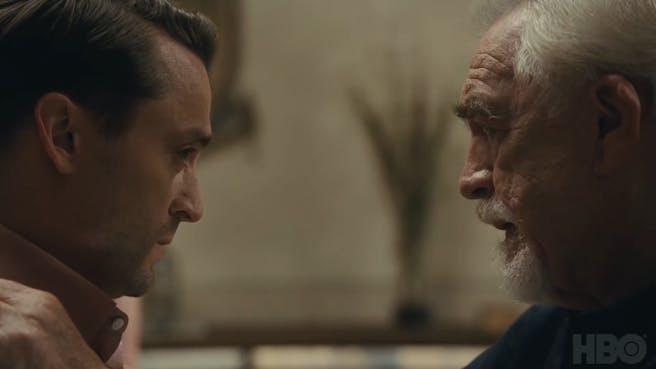 Two men look at each other