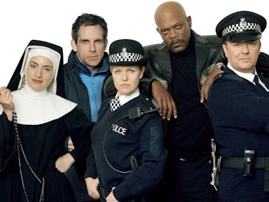 Two white women, one Black man and three white men stand in a line wearing various costumes; nun, police officers, admiral, etc.
