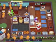 Birds eye view of game play of featureless figures in in a restaurant and some players in the kitchen cooking and serving up food