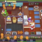 Birds eye view of game play of featureless figures in in a restaurant and some players in the kitchen cooking and serving up food