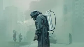 People in hazmat suits spraying the area, shrouded in fog