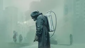 People in hazmat suits spraying the area, shrouded in fog