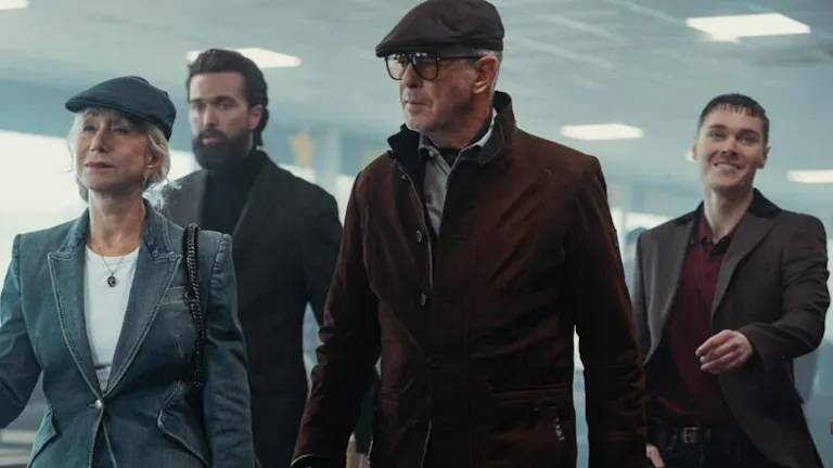3 men and 1 women wearing dark suit jackets walking threateningly in a building