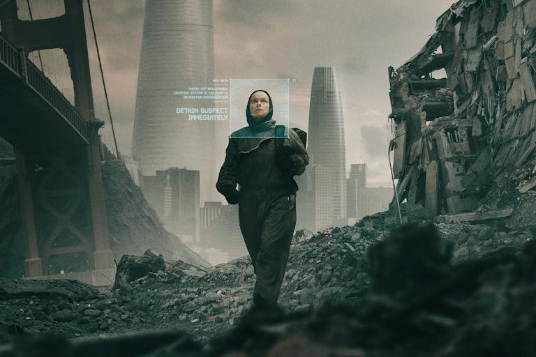 A white woman in dark clothes walking through an industrial apocalyptic wasteland with green descriptive text beside her face as if scanned