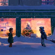 Two young children stranding in thick snow outside the orange slow of a shop front with a Christmas tree in the window