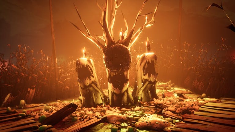 Gameplay of three burning tree stumps with mouth like bark with an orange glow