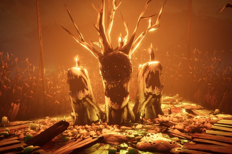 Gameplay of three burning tree stumps with mouth like bark with an orange glow