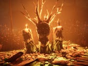 Gameplay of three burning tree stumps with mouth like bark with an orange glow