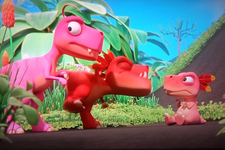 Colourful CGI animation of three small, cute pink and red dinosaurs