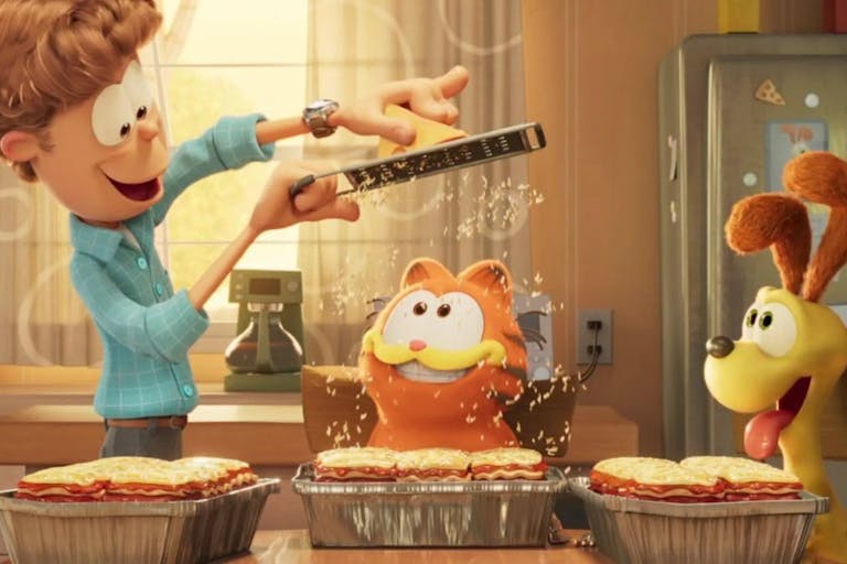 Colourful CGI animation of a white man grating cheese over a three trays of lasagne while an orange cat and yellow dog look on in delight