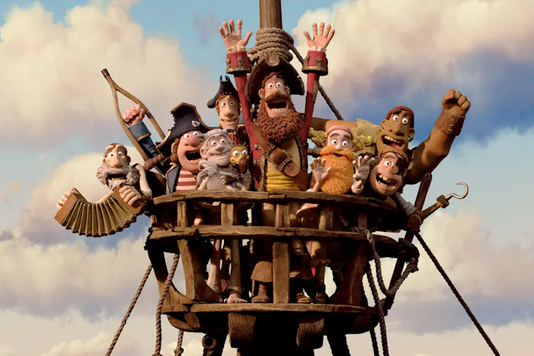 Claymation of a group of pirates atop a ship's wooden look out all cheering with their hands and objects in the air
