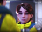 Gameplay of a white woman character with short brown hair in a yellow space suit looking in the mirror